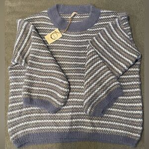 Sweater with metallic stitching